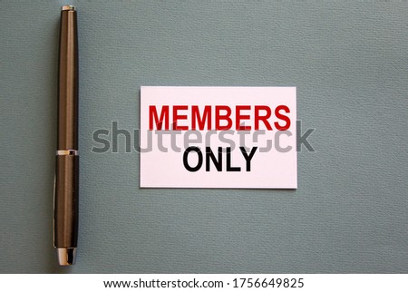 Pen and white card with words 'members only' on blue background. Business concept. Copy space.