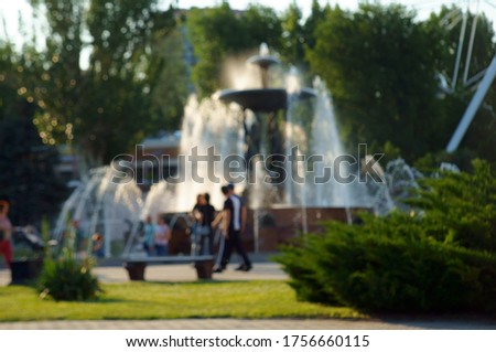 Blurred background. Fountain in the city Park.