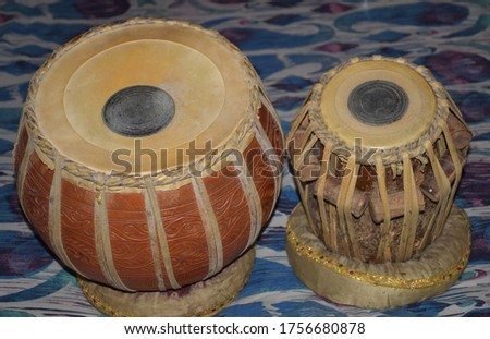 Tabla a musical instrument.It consists of two single-headed, barrel-shaped drums.The left part is called as baya and right part as Daya in Hindi Language. The bigger drum(left) is made of clay or mud.