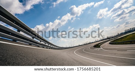 Race Car / motorcycle racetrack after rain on a sunny day. Fast motion blur effect. Ready to race Royalty-Free Stock Photo #1756685201