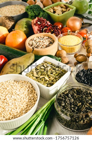 Close-up of raw and healthy food. Pumpkin Seeds, Cereals, Beans, and Fruits