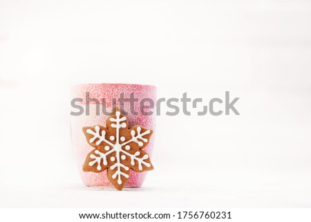 Snowy winter cup with gingerbread christmas cookies