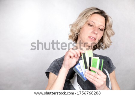 Business lady posing in the studio with credit cards
