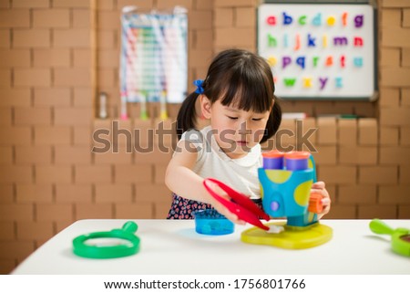 toddler girl  play microscope for homeschooling 