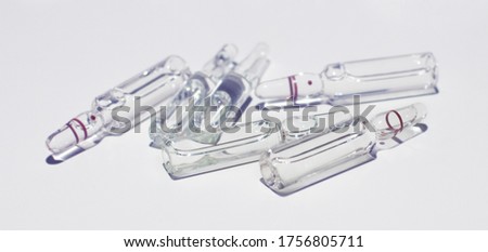 a lot of medical ampoules on the isolated background
