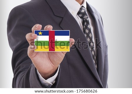 Businessman in suit holding a business card with Central African Republic Flag 