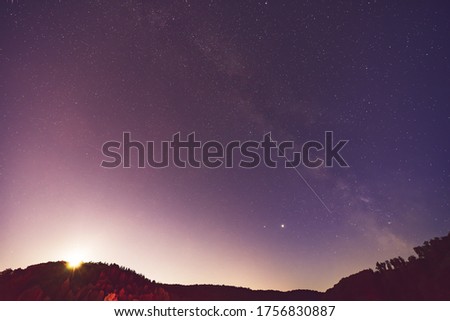 Summer Milky Way, Jupiter, Saturn planets and satellite light in the night sky.