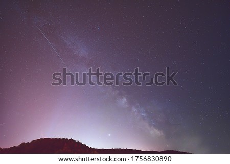 Summer Milky Way, Jupiter, Saturn planets and satellite light in the night sky.