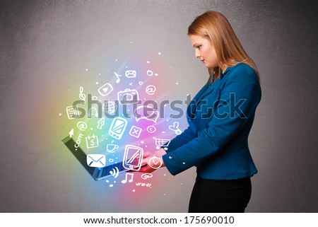 Beautiful young woman holding notebook with colorful hand drawn multimedia icons