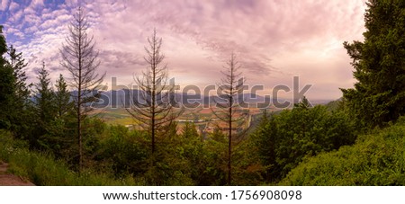 Beautiful Panoramic Landscape View of Fraser Valley from Abby Grind Hike during a colorful sunset. Taken in Abbotsford, East of Vancouver, British Columbia, Canada. Royalty-Free Stock Photo #1756908098
