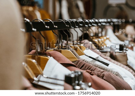 fashion clothing on hangers at the show