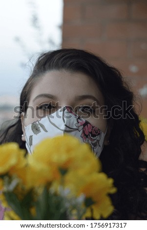 curly girl with mask looking at me