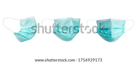Medical face mask isolated on white background with clipping path around the face mask and the ear rope. Concept of COVID-19 or Coronavirus Disease 2019 prevention by wearing face mask. Royalty-Free Stock Photo #1756929173
