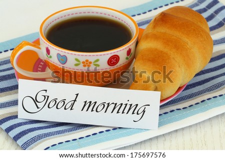 Good morning card with cup or tea and butter croissant 