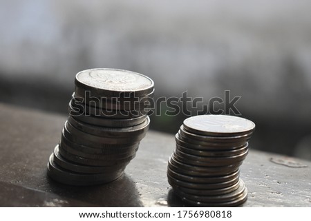 Stack of rupiah coins. Savings of coins. Indonesian coins. Indonesian rupiah Indonesian money.