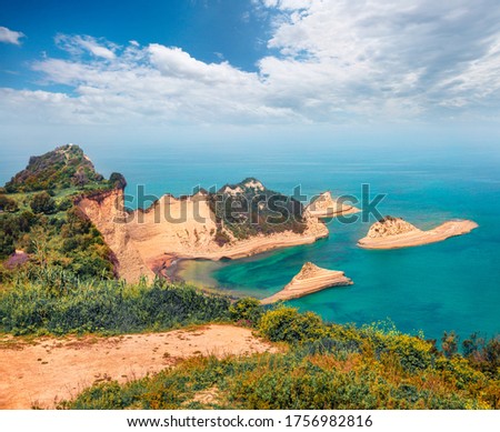 Breathtaking morning view of Cape Drastis thematic park. Picturesque morning seascape of Ionian sea. Wonderful outdoor scene of Corfu island, Greece, Europe. Beauty of nature concept background.