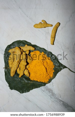 Turmeric on bowl Isolated in wooden