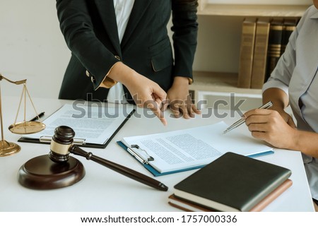 Lawyer explained to the client about the legal issues that must be taken in court in the office. Royalty-Free Stock Photo #1757000336