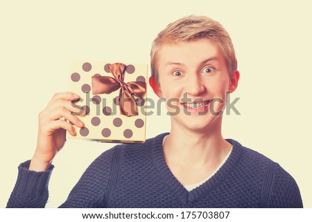Nerd teen guy with gift. Isolated.