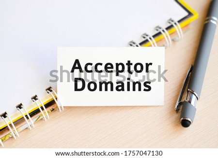 Acceptor Domain - text on a notebook with a spring and a gray pen
