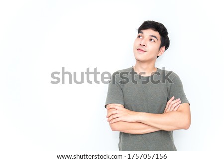 Beautiful positive asian man closeup portrait asian nerdy man look up with copyspace, social distancing. Handsome nerd Japanese asia guy wearing glasses with big smile isolated on white background.