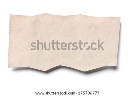close up of a piece of newspaper on white background