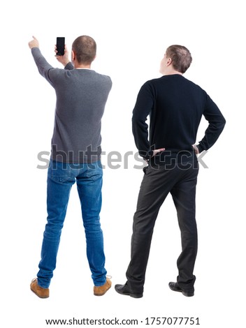 Back view of two man in sweater with mobile phone. Rear view people collection. backside view of person. Isolated over white background.