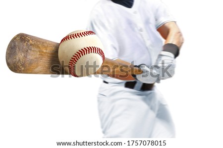 Baseball player hitting ball with bat over white background Royalty-Free Stock Photo #1757078015