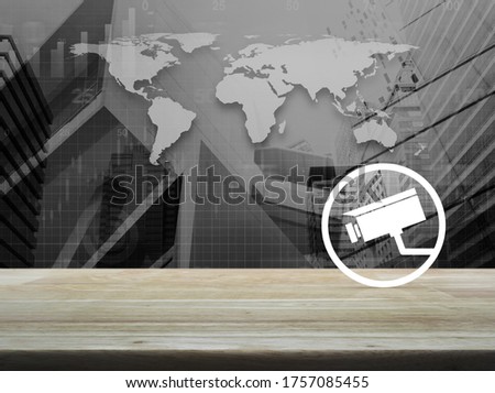 cctv camera flat icon on wooden table over black and white world map, city tower and skyscraper, Business security and safety online concept, Elements of this image furnished by NASA