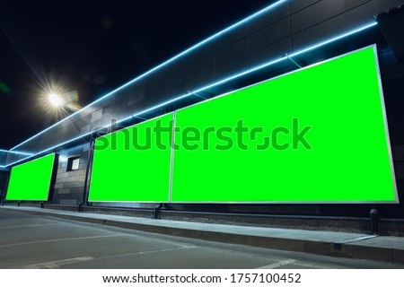 Blank citylight for advertising on the building at city, copyspace for your text, image, design. Media marketing, ads, promo announcement, commercial propose or message. Banner, template chromakey.