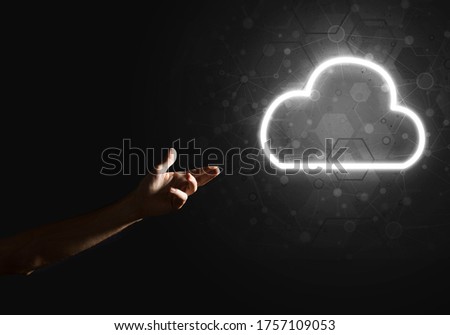 Man hand holding cloud computing concept in palm