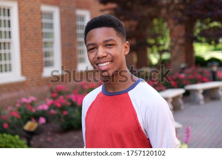 African American teenager outdoors smiling at the camera Royalty-Free Stock Photo #1757120102
