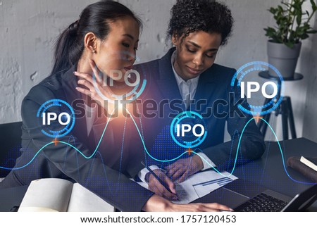 Two businesswomen work together in modern office on new project. Double exposure. Concept of success. IPO symbol icon.