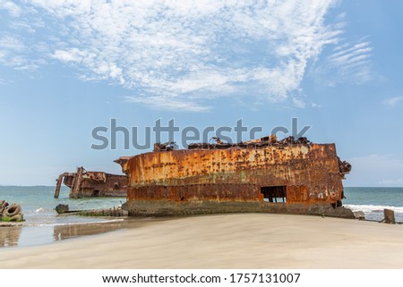 View of a abandoned ships carcasses in the ships cemetery, graveyard ships on the atlantic ocean, Angola, Africa Royalty-Free Stock Photo #1757131007