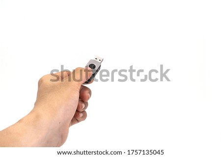 Flash Drive in Hand on White Background.
