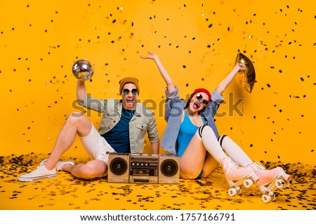 Portrait of his he her she nice attractive cheerful glad couple friends friendship resting having fun disco leisure isolated bright vivid shine vibrant yellow color background