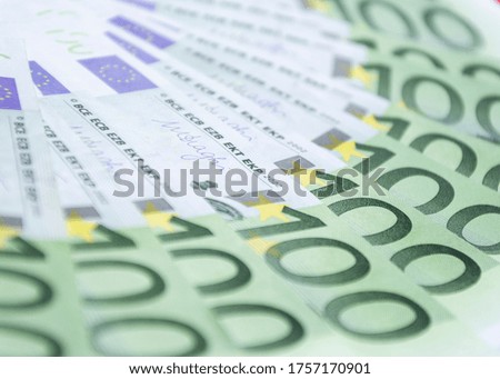 Currency of the European Union of different denominations on an orange background