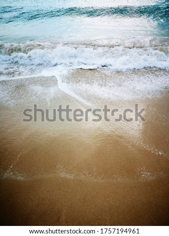 This is an image of the shore of the beach. The image was taken during the summer and the sunset. 