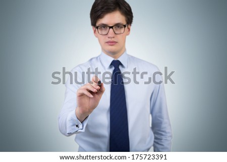 Businessman pointing by the pen