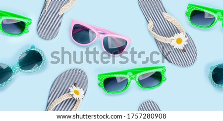 Sunglasses and flip flops summer seamless texture. Fabric daisy pattern backdrop over blue background
