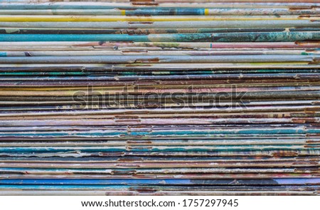 photo texture of a stack of old magazines