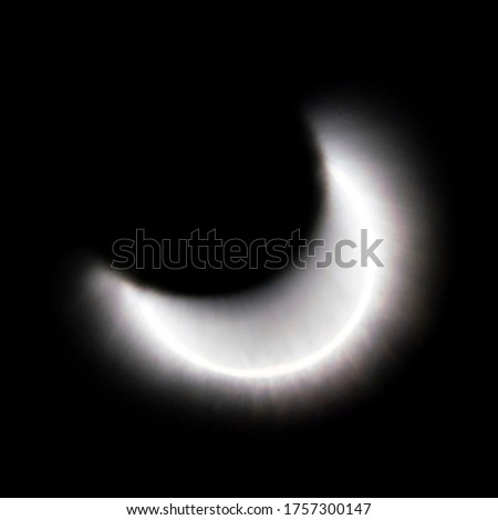 White Light flash in the form of a Crescent on a black background.Texture or background