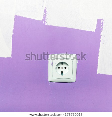 Electrical outlet on wall, interior . Pantone color of the year 2018 - ultra violet