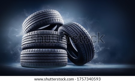 close up of four tires against black