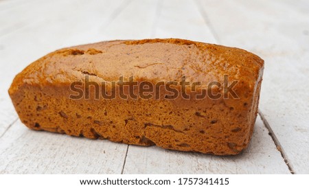 Gluten-free whole grain rye bread on the white wooden background. Healthy food concept..