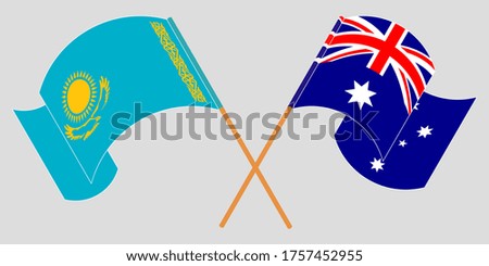 Crossed and waving flags of Kazakhstan and Australia