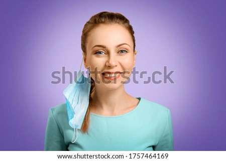 The girl incorrectly put on a protective mask. The nurse teaches you to put on a mask. Protection from disease and virus. Disposable mask. Self-isolation protection. The woman doctor smiles. Royalty-Free Stock Photo #1757464169
