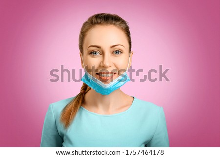 The protective mask on the girl is incorrectly put on. A masked nurse. Wrong. Quarantine during the virus. Self-isolation and illness. The doctor smiles. Coronavirus and protection. Royalty-Free Stock Photo #1757464178