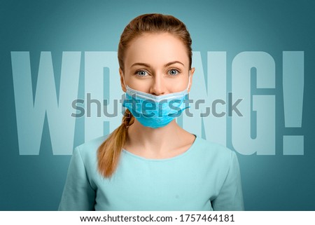 The protective mask on the girl is incorrectly put on. A masked nurse. Wrong. Quarantine during the virus. Self-isolation and illness. The doctor smiles. Coronavirus and protection. Royalty-Free Stock Photo #1757464181
