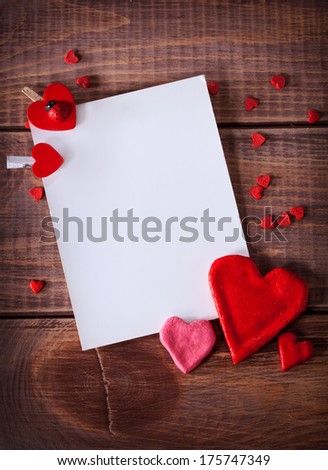 card with hearts on a wooden background